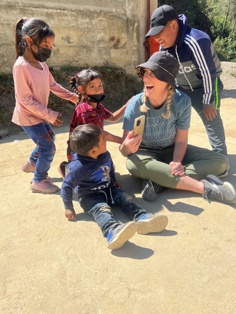Beth Houf plays with children in Guatemala during the Lifetouch Memory Mission.