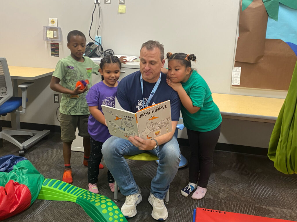 Principal reading book to students